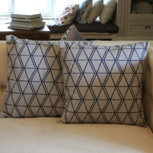 Diamond pattern cushion in grey and navy